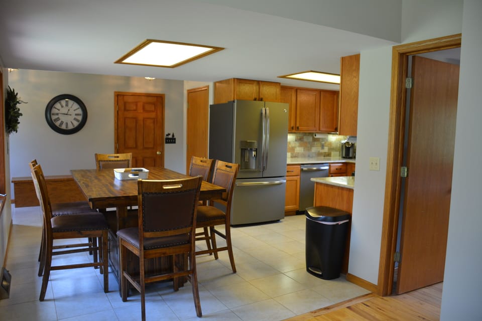 Kitchen area with dining table that seats 6