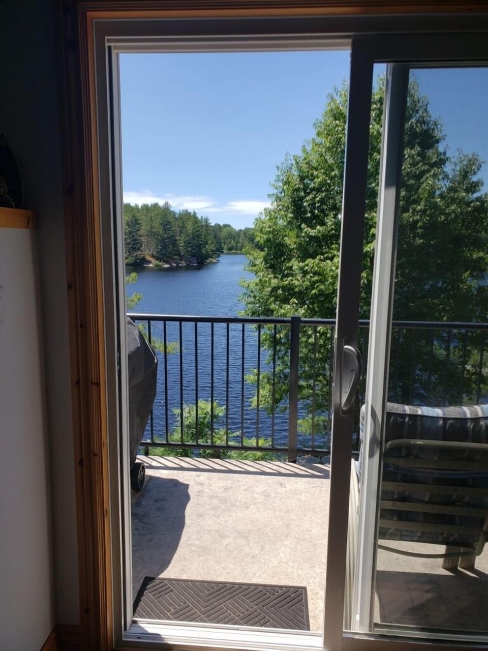 Lake view through sliding door in kitchen/dining area