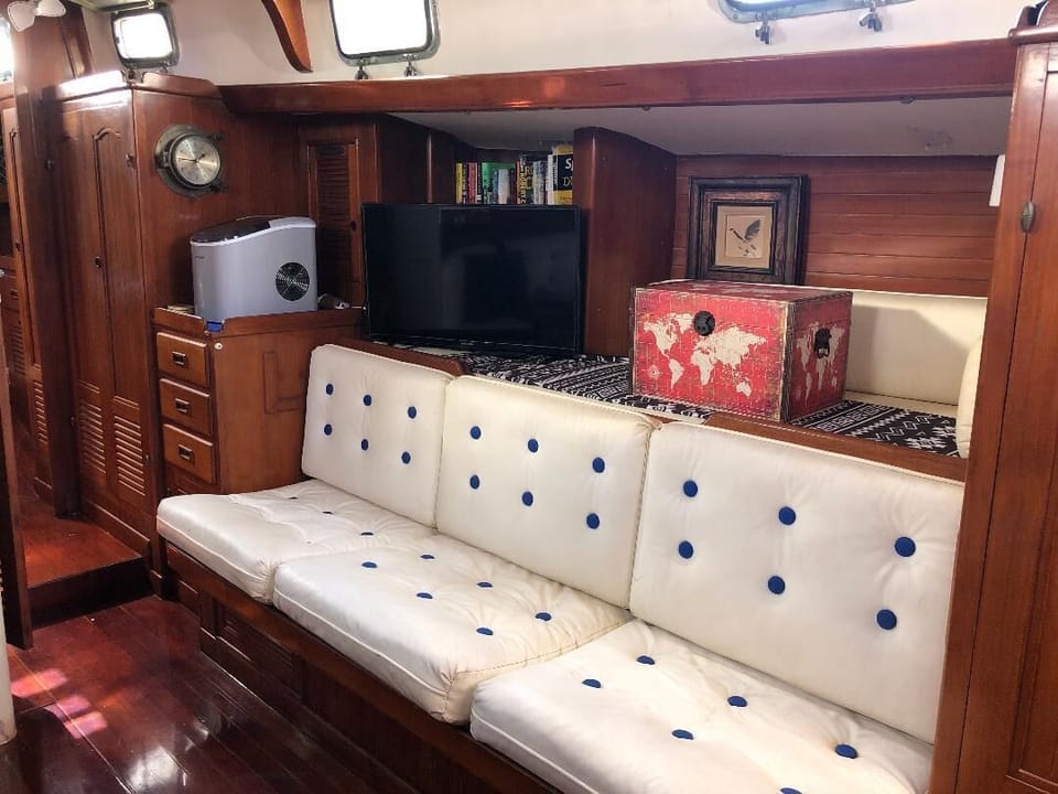 Additional seating and TV, across from dining area