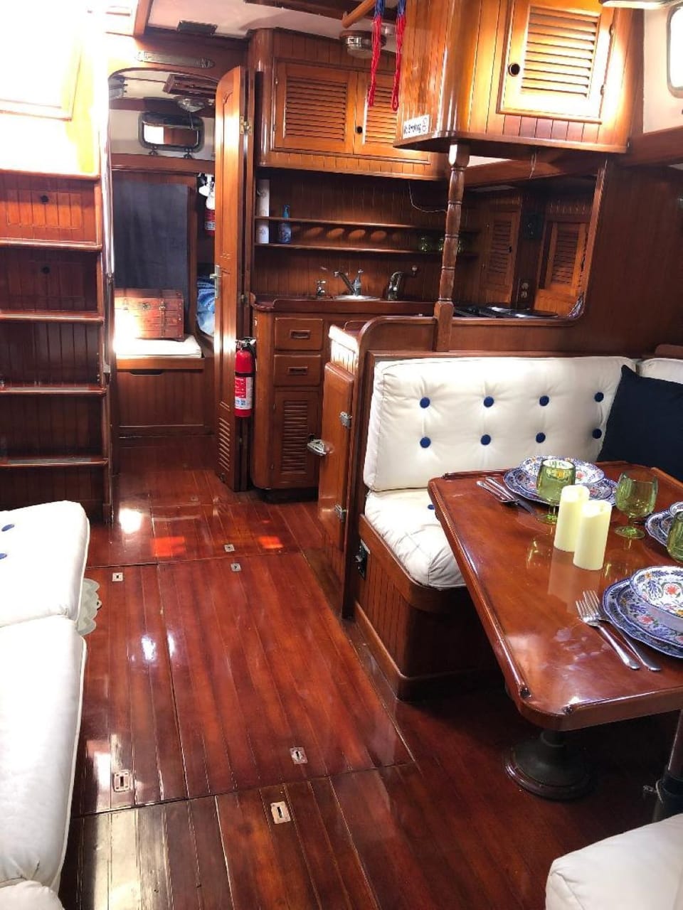Looking aft with Dining Area, Kitchen and Primary Stateroom in background.