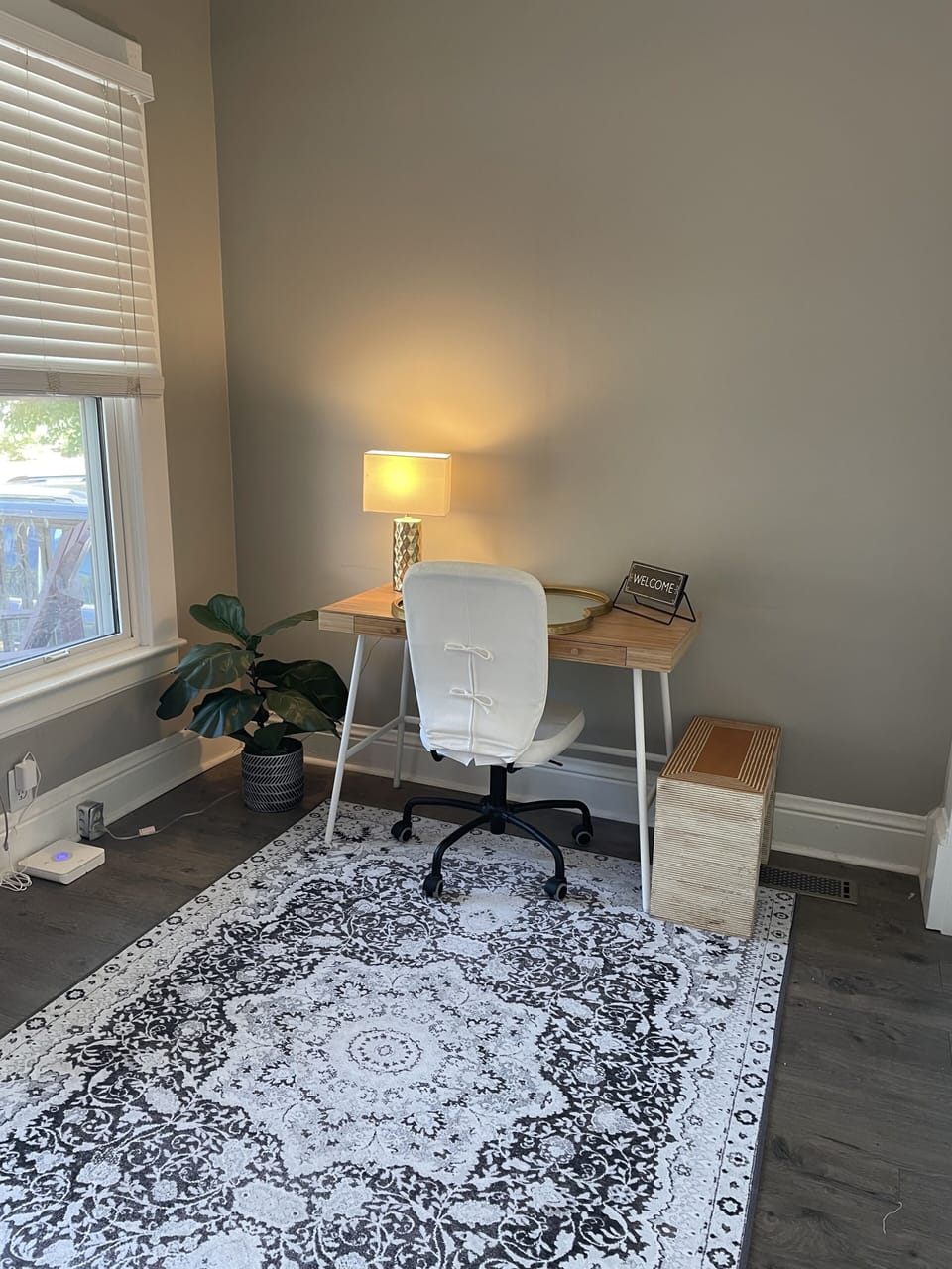 Front room office with desk; washer and dryer (not pictured)