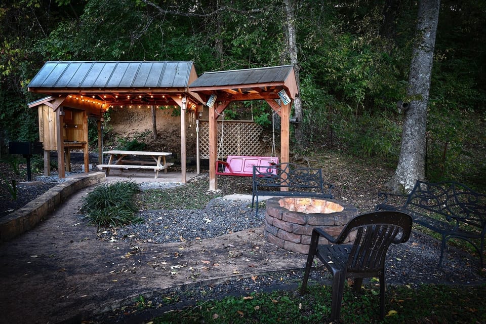 Back yard fire pit and swing at sunset.