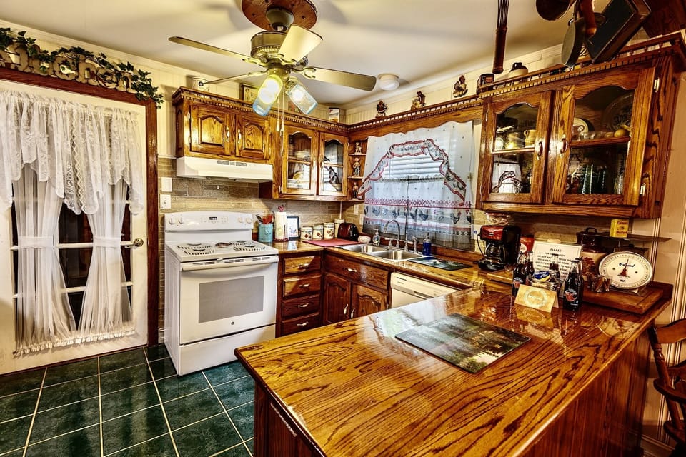 Kitchen and door to laundry room and screened-in porch.