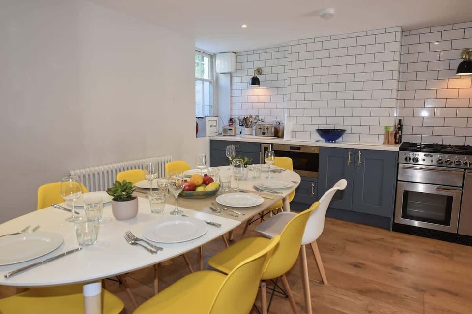 The social heart of the home: a large open-plan kitchen and dining room with a table for eight.