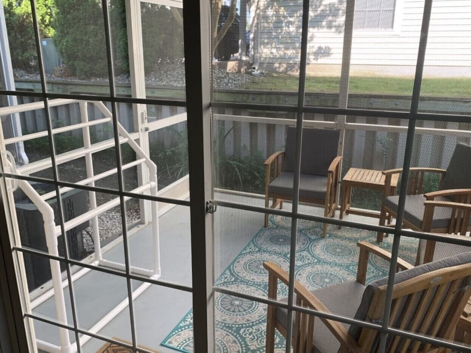 The porch has a white drying rack for your swim suits and towels.