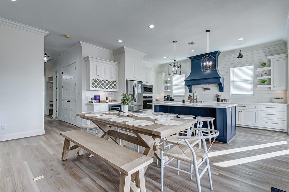 Custom-built, open-concept kitchen with high-end finishes and custom wine bar. 