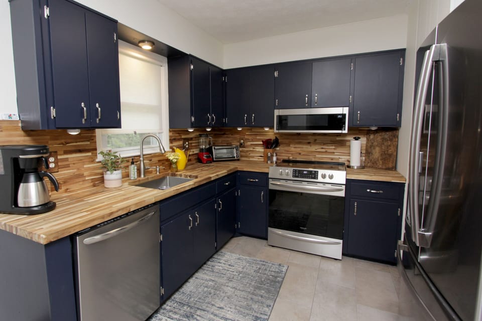 Updated kitchen w/ new appliances fully stocked w/ amenities. 