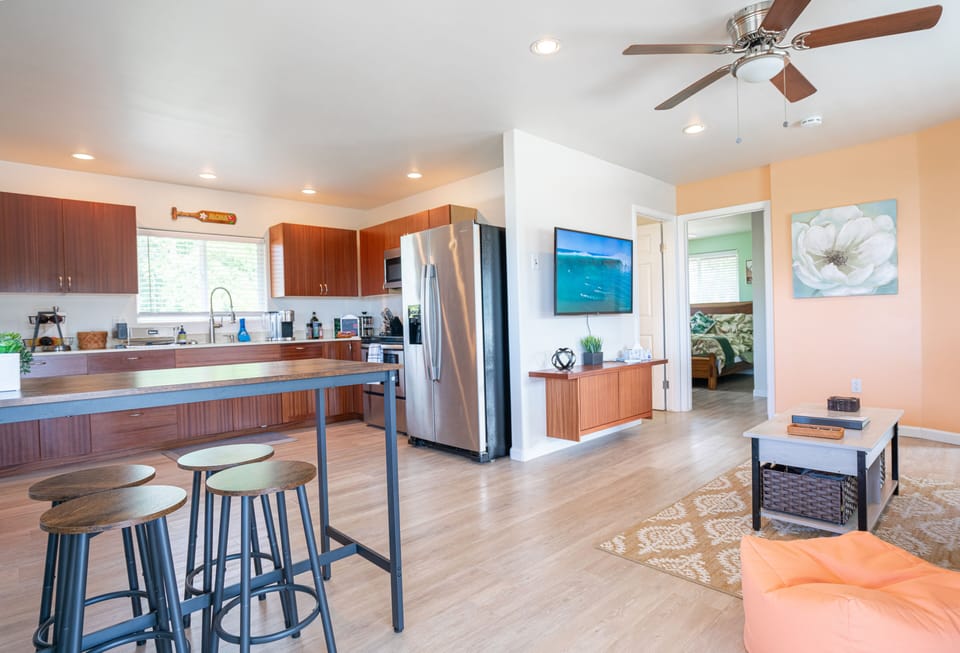 indoor dining, kitchen space and common area, all open design.