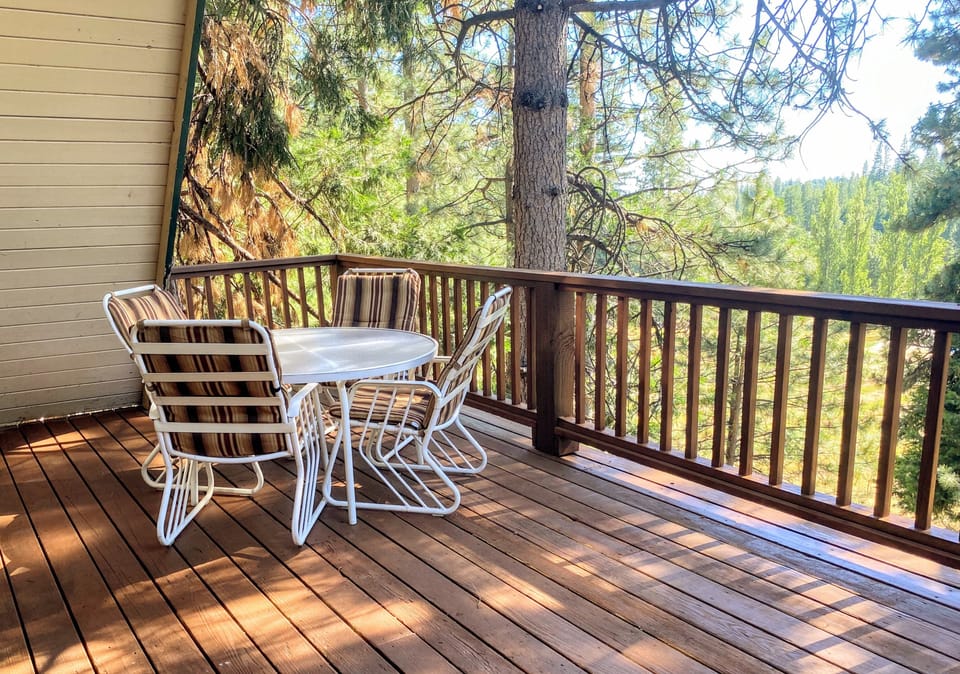 Deck with outdoor furniture and a bbq grill