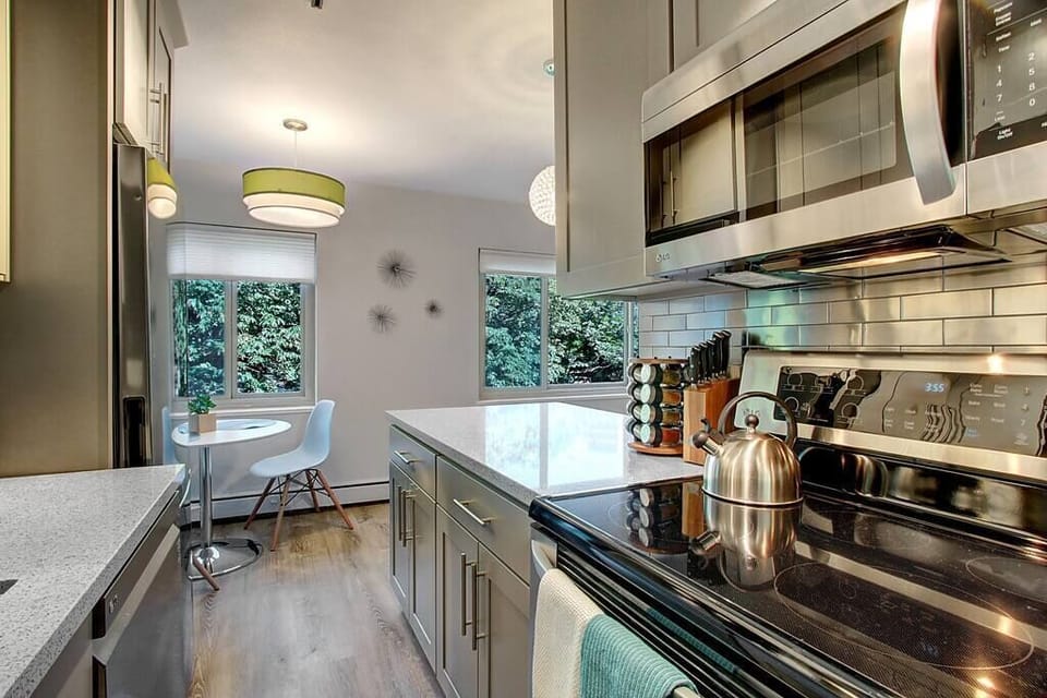 Modern stainless steel appliances with cooking essentials allow you to make a meal or two. 