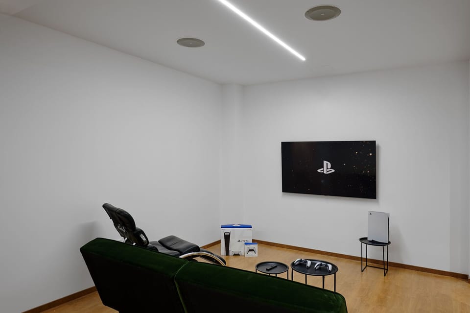 Playroom on the lower floor with PS5 and 65" TV