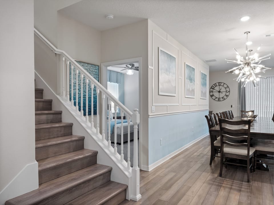 Spacious Downstairs Area with Full Size Kitchen, Barstool Seating, and Dining Table