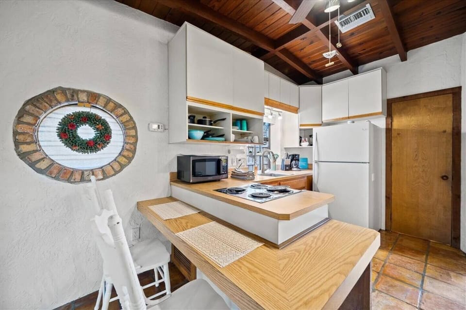 Be a part of your family's day while preparing a meal in the open concept kitchen area. Extra counter space for breakfast, or to work remotely using our high speed free WiFi.