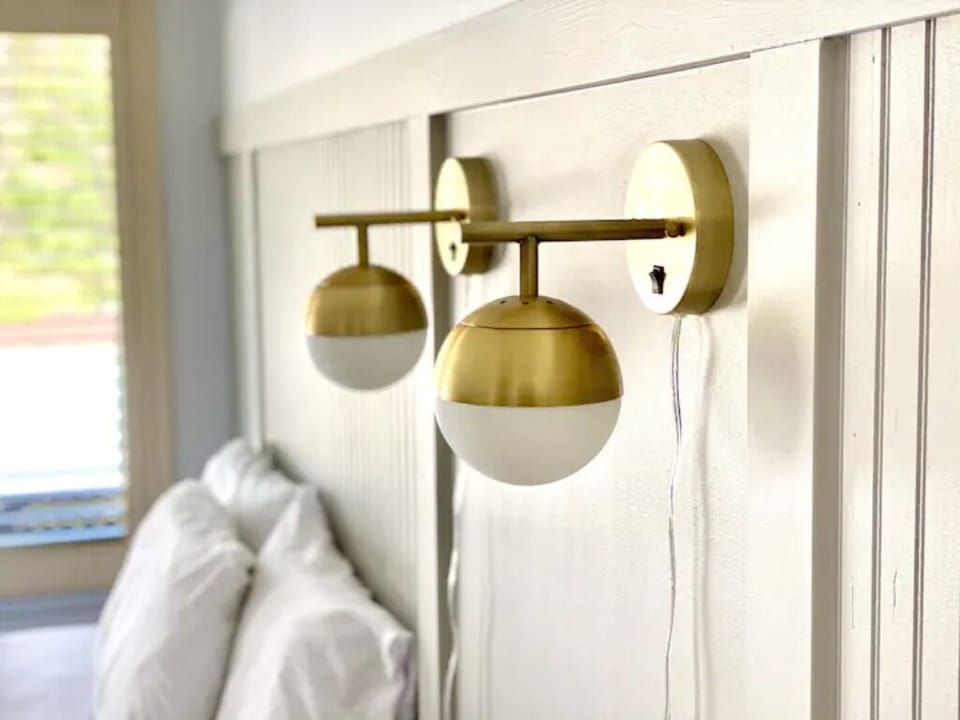 Mounted bedside lighting.