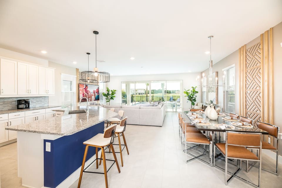 Living area - kitchen island, dining room table, couch