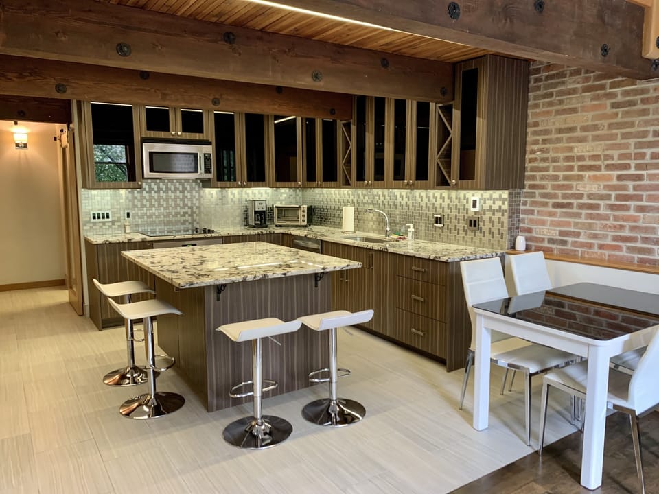 Gourmet kitchen with island and dining table