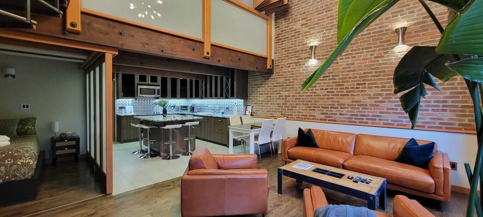 Living room (right), kitchen (centre), queen bed (left), mezzanine (top)