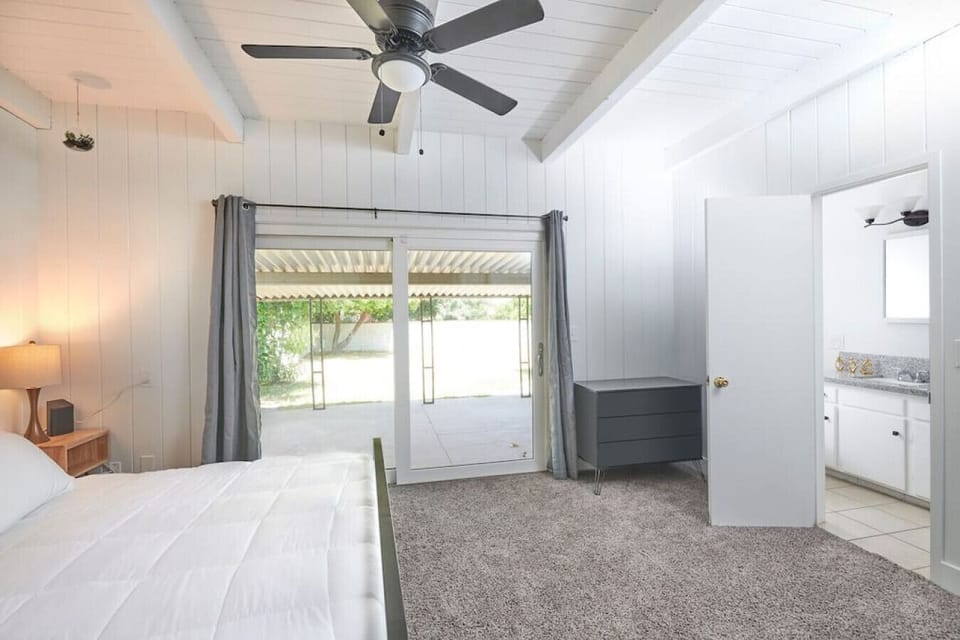 Bedroom 1- King Bed, full bathroom, and an outdoor view.