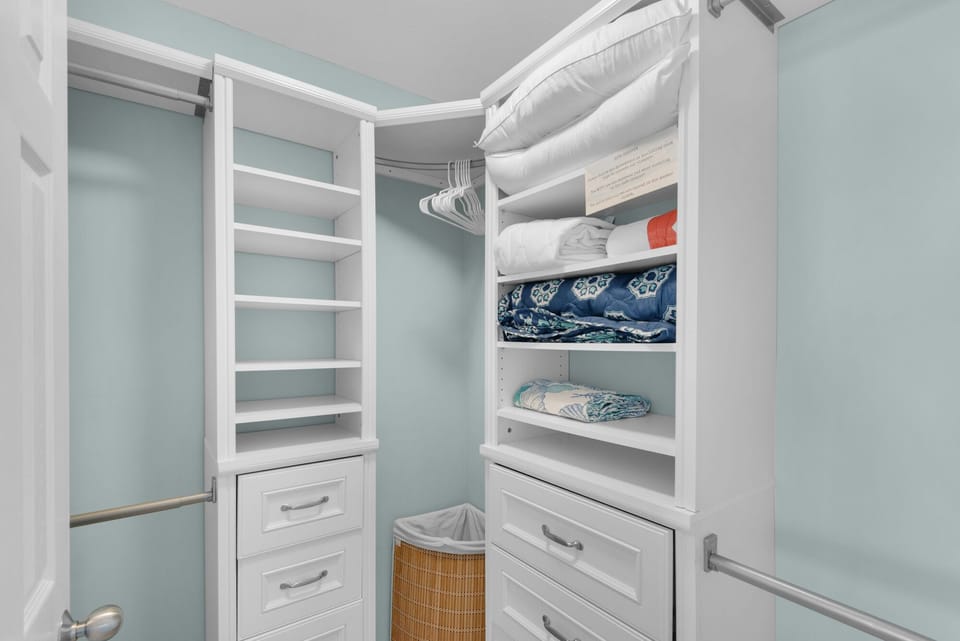 Your spacious walk-in closet offers abundant storage with custom shelving, drawers, and hanging space to keep your belongings perfectly organized.