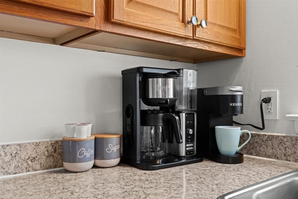 Enjoy a quick Keurig coffee or grind fresh beans for a rich brew.
