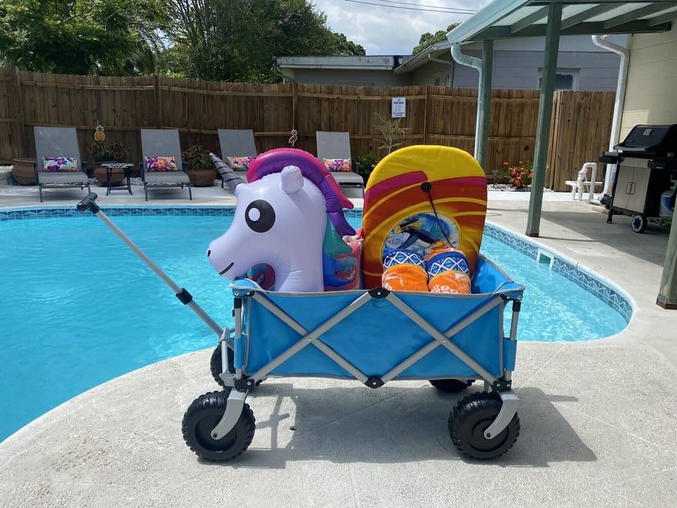 Pool toys, beach towels, beach chairs, and beach umbrella provided. 