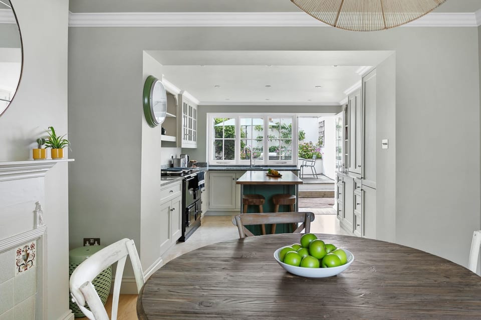 Dining space leading to kitchen with access to garden - Poplar Cottage