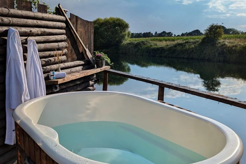 Private hot tub for two with logs