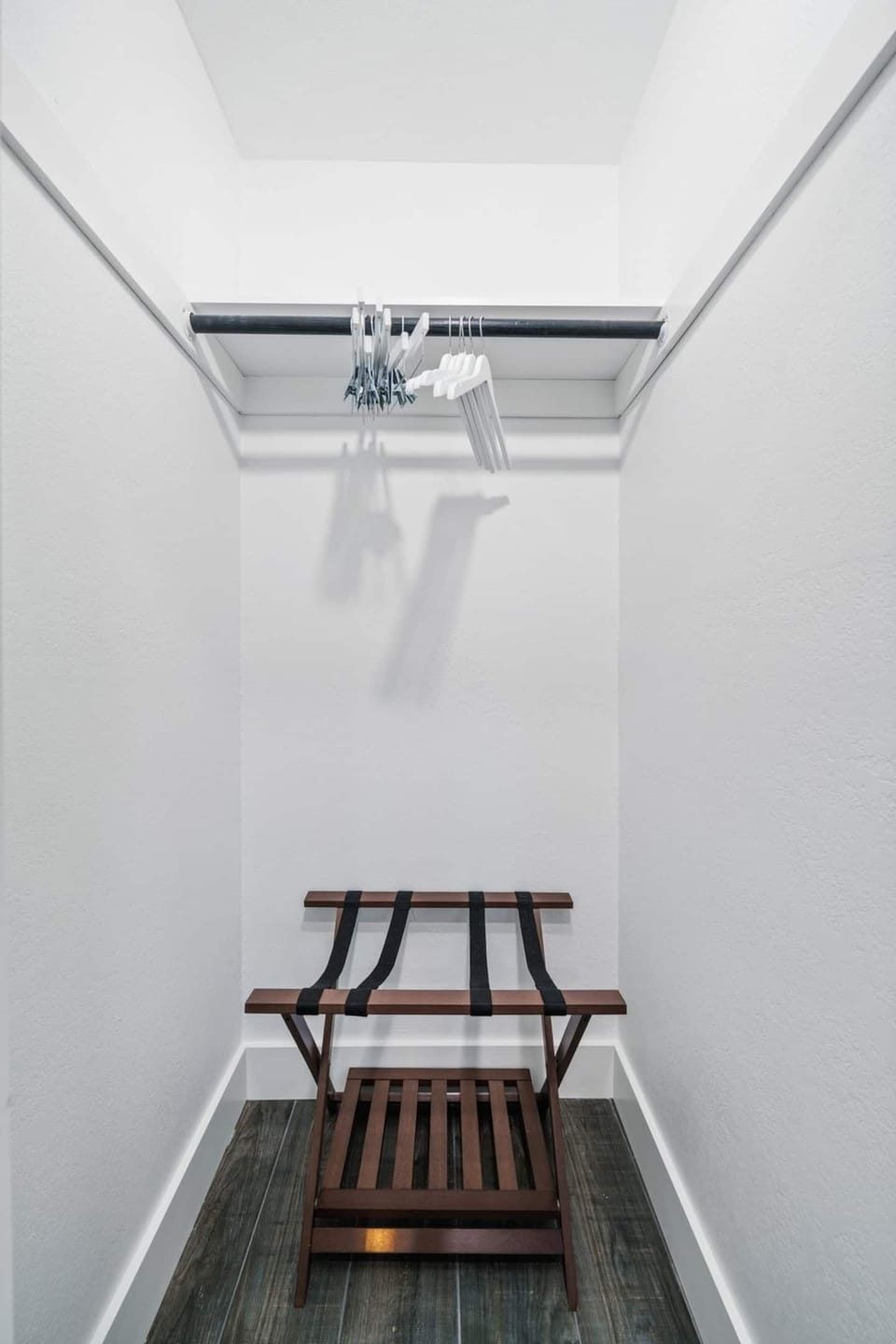 Large closets with suitcase racks