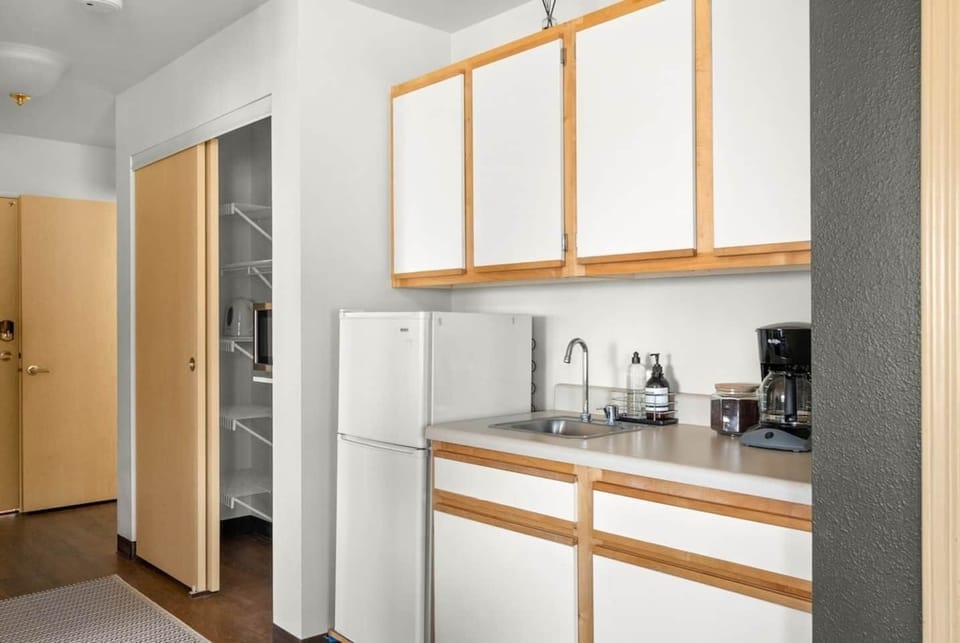 Kitchenette with microwave, mini-fridge and coffee maker. Perfect for a quick breakfast to enjoy on the patio!