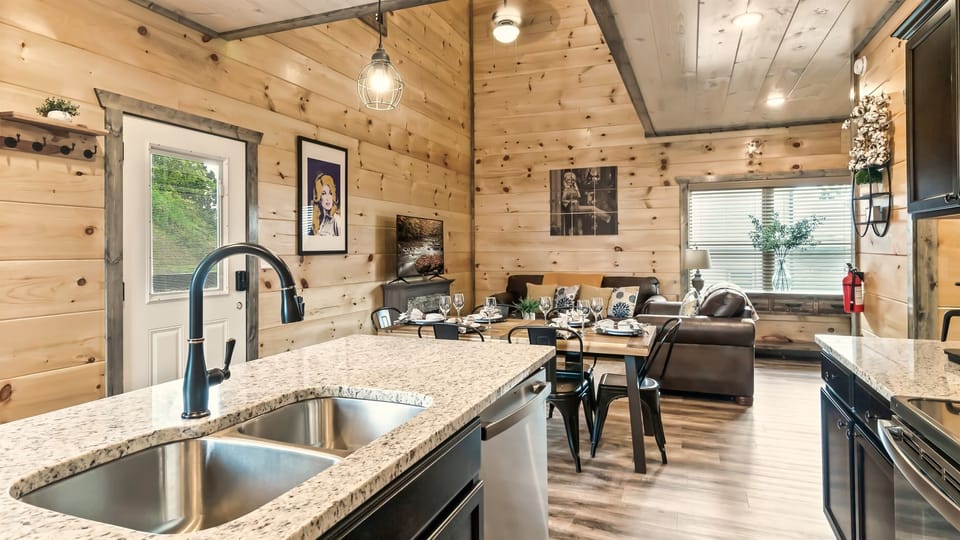 Imagine cooking up a delicious meal in this beautiful kitchen, then gathering with loved ones in the cozy living area.