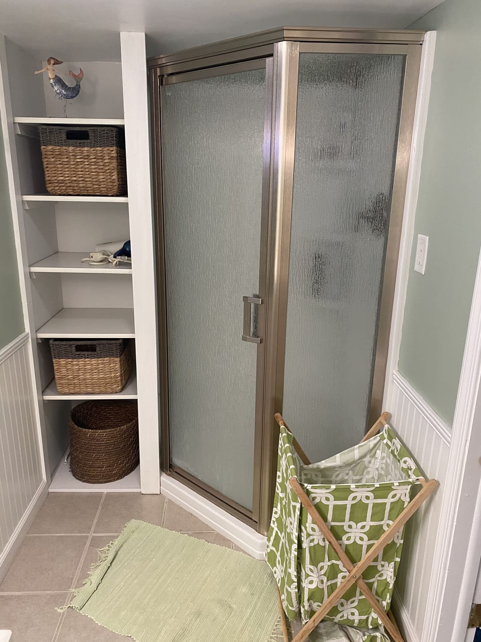Lower level bathroom with shower stall.