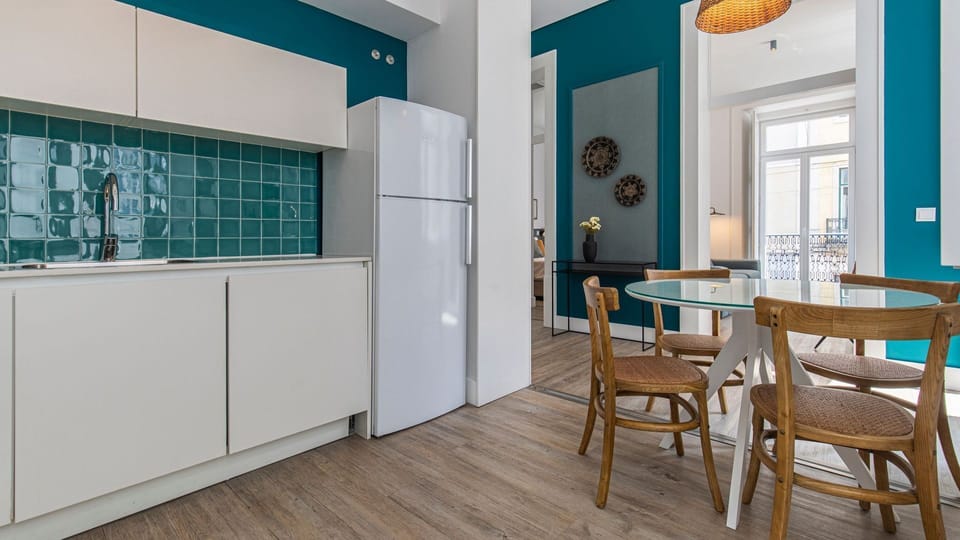 Fully equipped kitchenette for your home cooked meals. The dining area has natural light sources near it #homecooking #naturallight #portugal #pt #lisbon