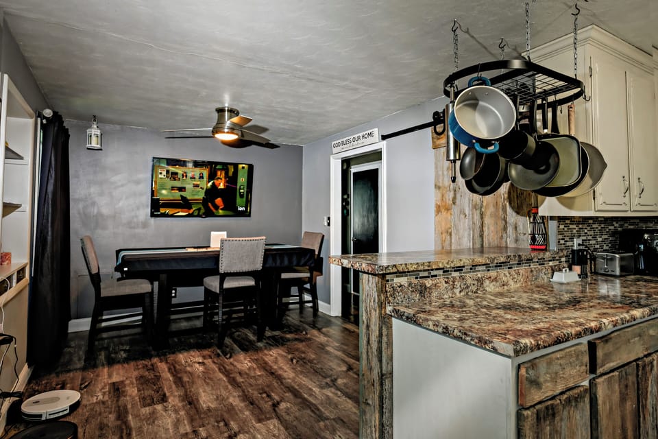 Dining table with nearby TV for meals or game night.