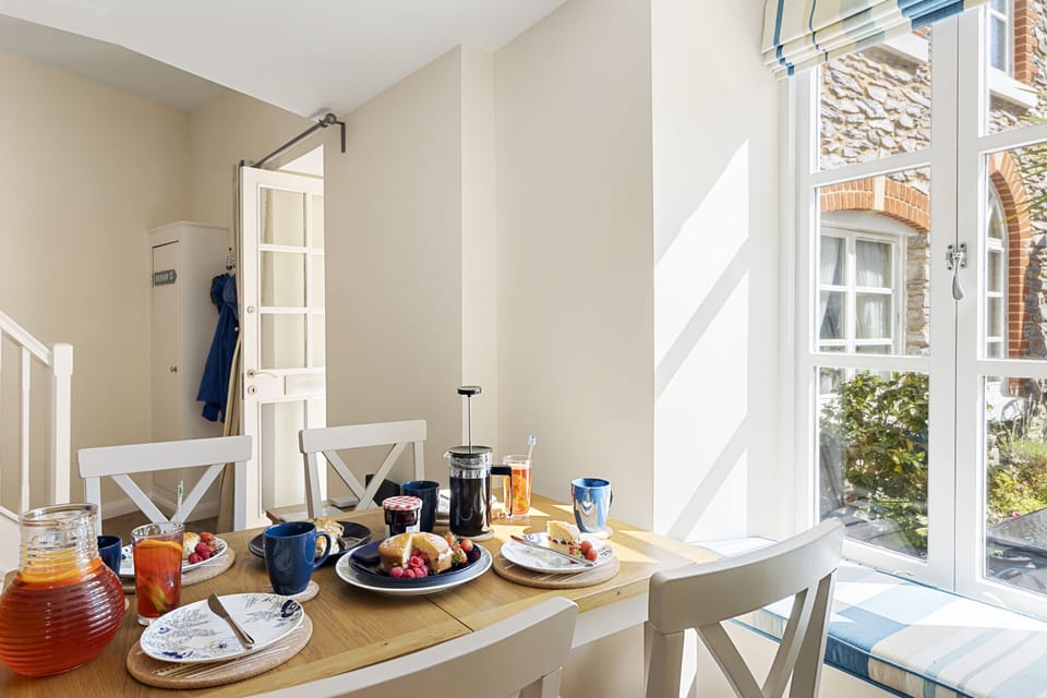 Enjoy your meals together at the dining table that seats four, with views of the courtyard.