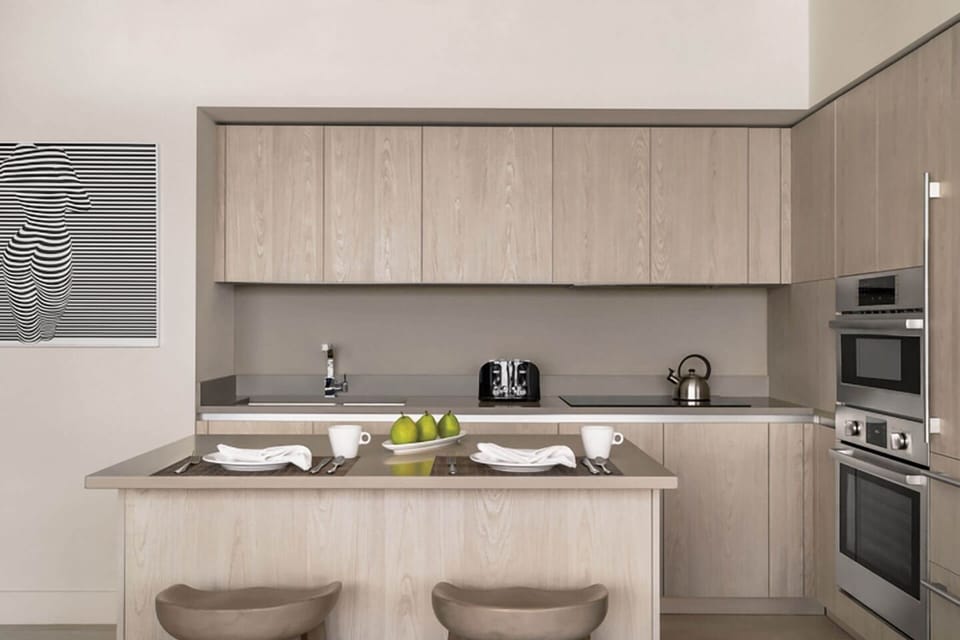 Gather for snacks at the breakfast bar with stylish seating.