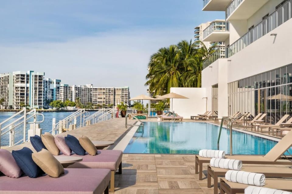 Unwind poolside with bay breezes and plush loungers.