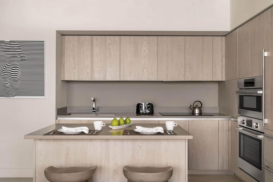 Gather for snacks at the breakfast bar with stylish seating.