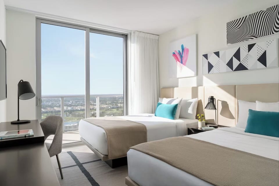 Stretch out in serene beds while sunlight pours through windows.