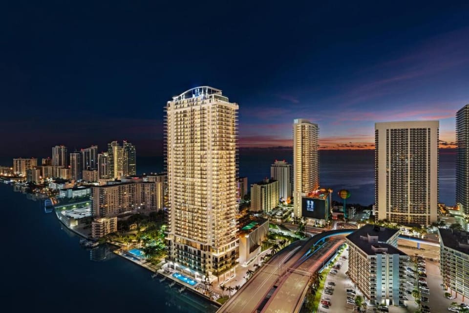 Watch the city sparkle as the coastline lights up.