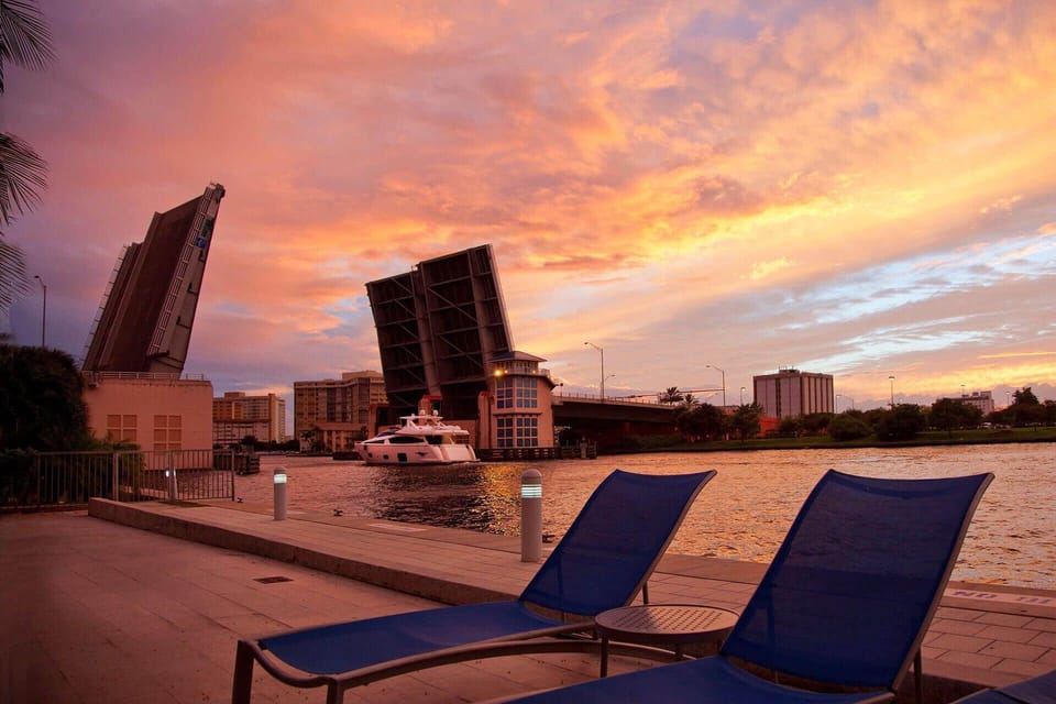Unwind at sunset with waterfront loungers and glowing skies.