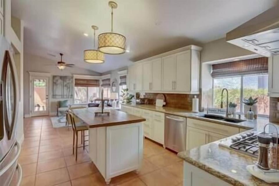 Kitchen has everything that you would need from blender, coffee grinder, to pizza pans. 