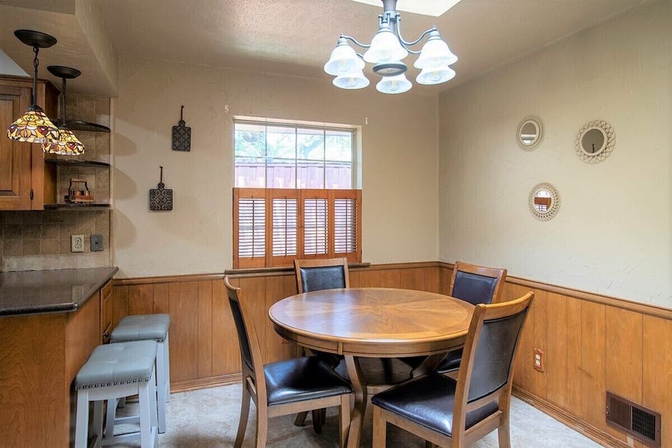 Breakfast nook and barstools seat 6 comfortably.
