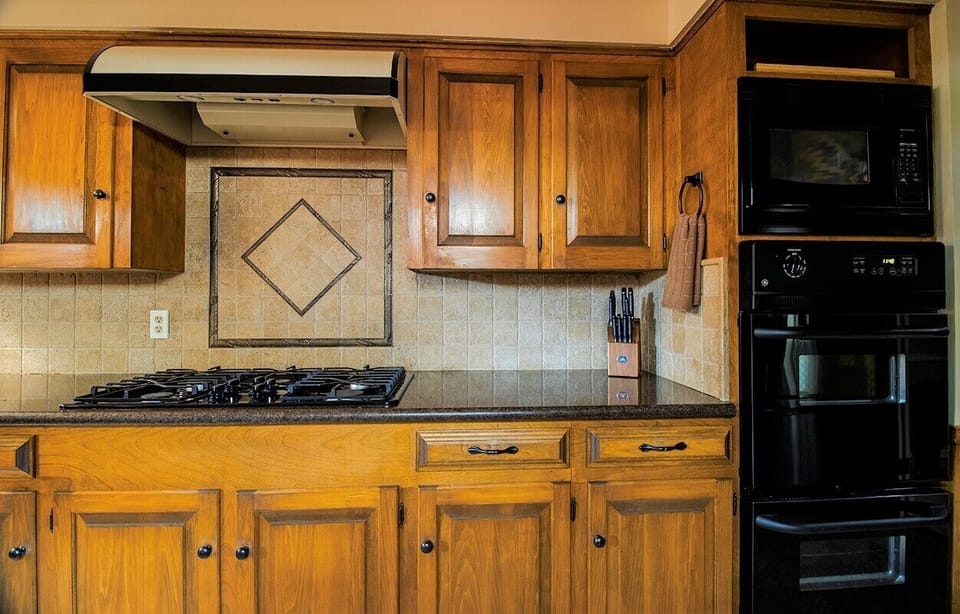 Microwave, double oven, and 5-burner gas stove for any cooking needs!

