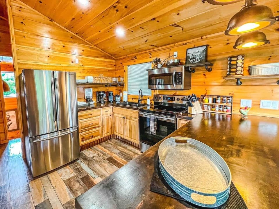 As you enter The cabin, you'll be welcomed by our large, open kitchen fully stocked with all your cooking essentials. All you need is the food! We include coffee makers, blender, toaster, etc.