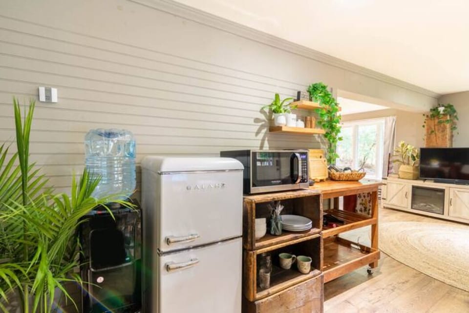 Fridge/freezer, water bubbler, microwave, dishes, coffee, salt/pepper, s'mores