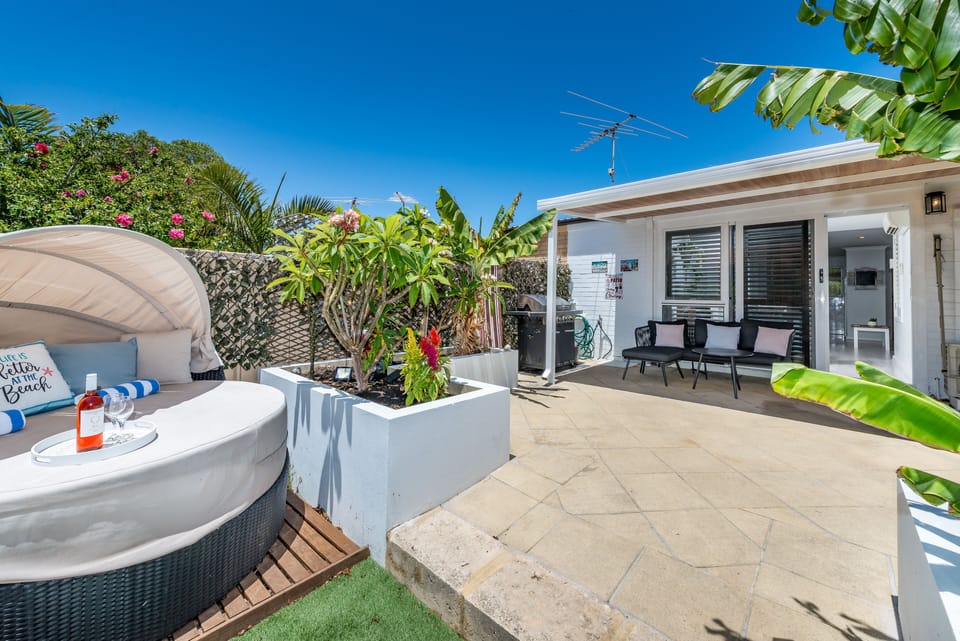 Seated lounge and table under the alfresco close to the Barbecue
