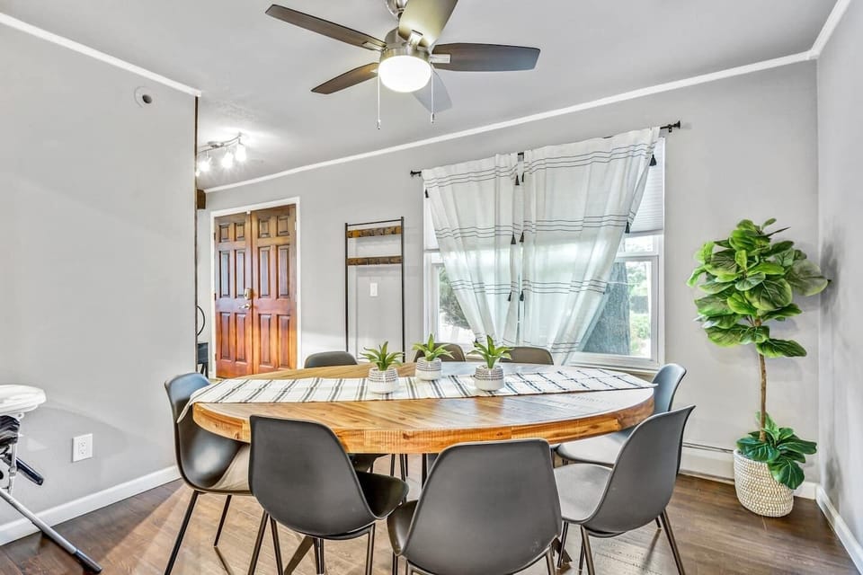 Dine together at the large round dining set with seating for 8.
