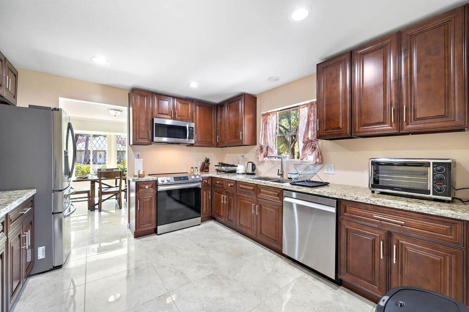 Fridge dispenses water and ice! Stainless steel appliances.