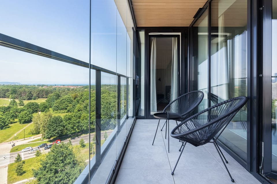 Balcony with garden furniture and nice view of the surrounding green areas.