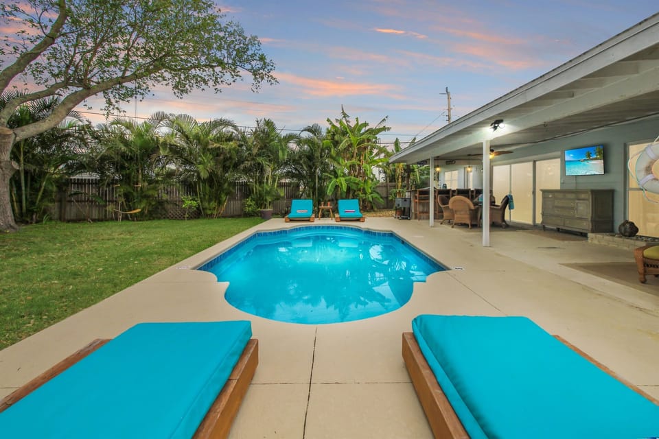 Lounge beside a heated pool and enjoy the outdoor living/dining/bar areas with smart TV